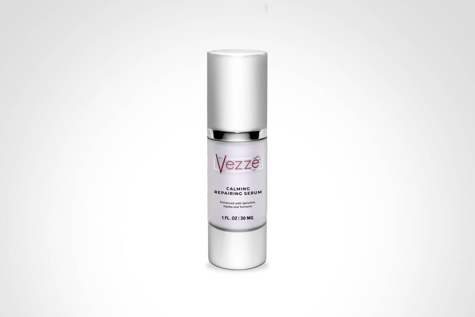 Calming repairing serum bottle, infused with spirulina, jojoba, and turmeric, 1 fl oz size on white background.